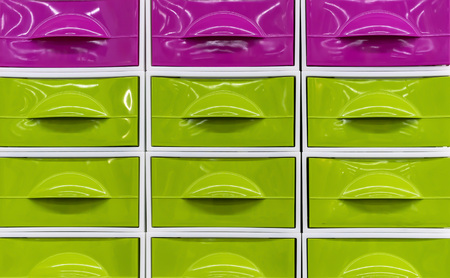 Bright plastic boxes for storing household items.の写真素材