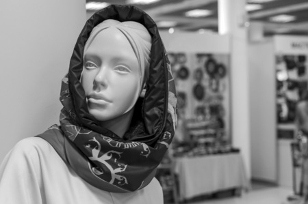 Vintage female mannequin in a clothing store.の写真素材