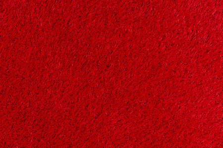 Texture of a red carpet with a short nap.の写真素材