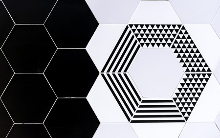 Ceramic tiles with geometric patterns. Background black and white ceramic tiles.
