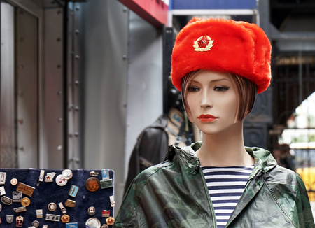 Female mannequin in a souvenir red Russian military cap.の写真素材