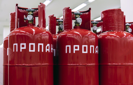 Red cylinders of propane gas. The inscription in Russian - propane.の写真素材
