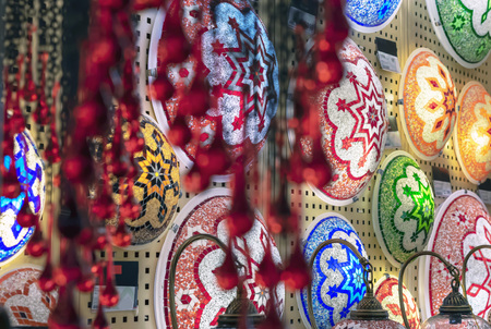 Oriental lamps from a multi-colored mosaic in the shop window.の写真素材