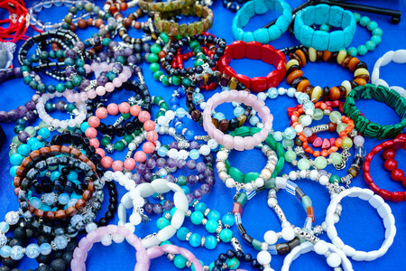 Jewelry made of natural stones on a blue background.の写真素材