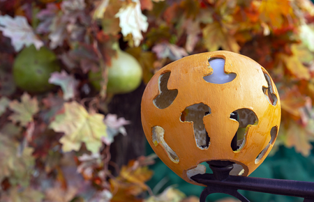 Pumpkin lantern with carved mushroom silhouettes.の写真素材