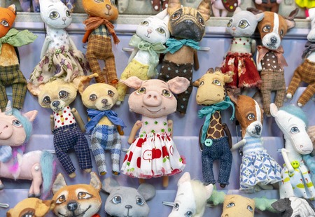 Stuffed toys of various animals in a street shop.の写真素材