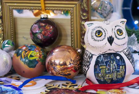 Ceramic statuette of an owl next to the Christmas decorations.の写真素材
