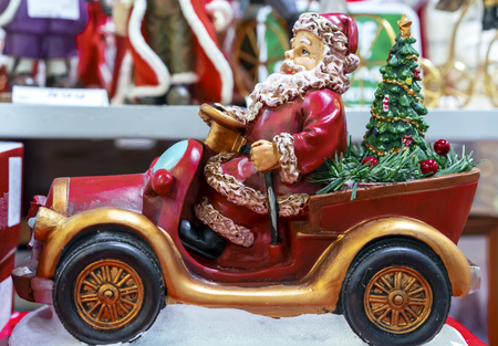 Ceramic figurine of Santa Claus on the car.の写真素材