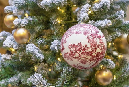 Large ball with floral ornaments on the Christmas tree.の写真素材