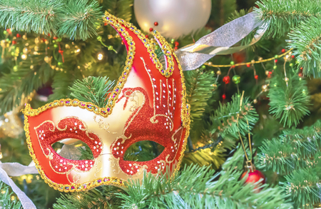 Colorful carnival mask on the background of the Christmas tree.の写真素材