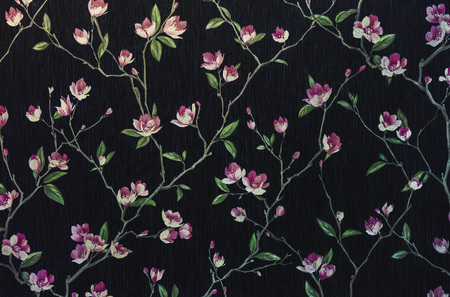 Fragment of a decorative panel with a floral pattern. Floral background for design and decoration. Flowers on a black background.の写真素材