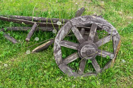 Old wooden cartwheel. Wheel from the old horse-drawn cart.の写真素材
