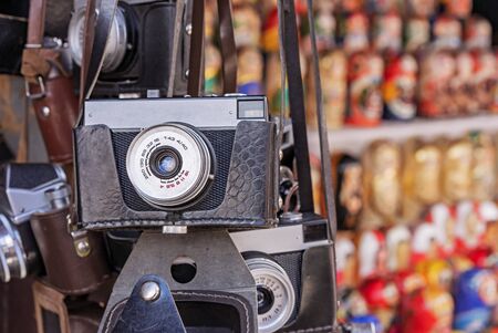 Vintage camera in a black leather case. Old camera at a flea market.の写真素材