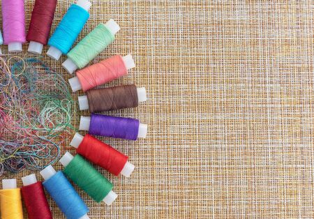 Multicolored sewing threads. Spools of thread for sewing. The concept of sewing accessories.