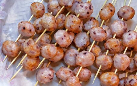 Balls with an octopus on wooden skewers. National Vietnamese dish.の写真素材