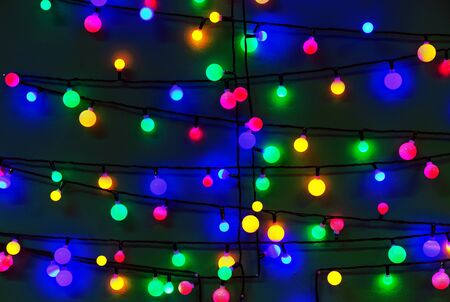 Glowing Christmas garlands. Background with christmas light.