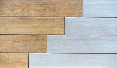 Brown and gray porcelain tiles with imitation of wooden boards.の写真素材