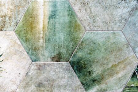 Porcelain tile with floral ornaments. Texture of aged ceramic tiles.