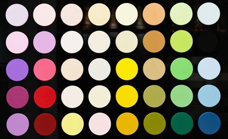 Circles with a color palette on a black glossy background. ?olor palette from saturated colors to...
