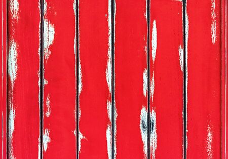 Texture of red wooden boards with scuffs. Wood background for design and decoration.の写真素材