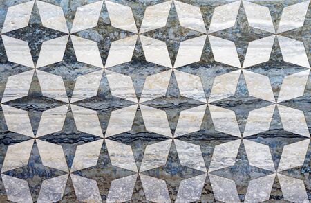 Dark blue porcelain tile with an ornament. Background and texture of porcelain stoneware.の写真素材