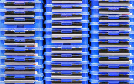 Dark blue plastic boxes for storing household items.の写真素材