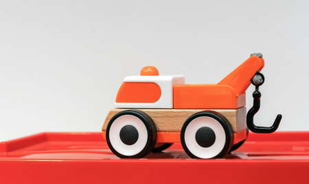 Children's wooden toy car with a crane. Eco-friendly children's toys.の写真素材