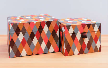Boxes with multi-colored diamond-shaped pattern for gift wrapping.の写真素材