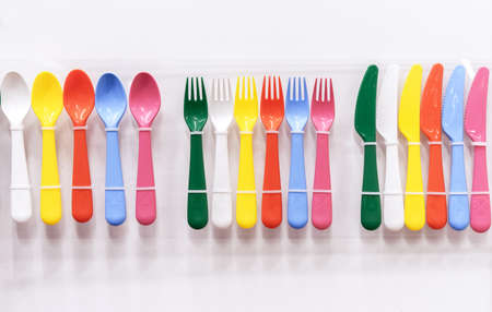 Multi-colored plastic cutlery for a children's party.の写真素材