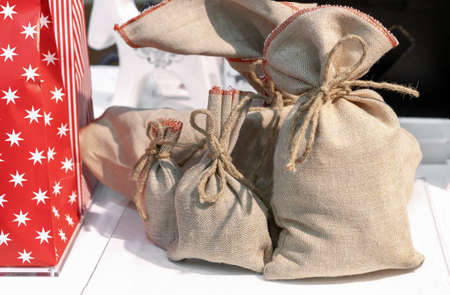 Burlap bags with drawstring for wrapping Christmas gifts.の写真素材