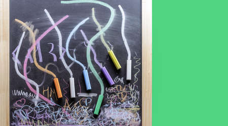 Chalk board with colored crayons for writing and drawing.