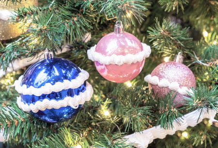 Multicolored Christmas balls with imitation of butter cream on the Christmas tree.の写真素材