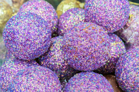 Lilac Christmas balls with payettes. Background with shiny Christmas balls.の写真素材