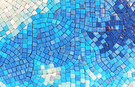 Ceramic mosaic tiles with white, blue and dark blue squares, laid out in a chaotic manner.の写真素材