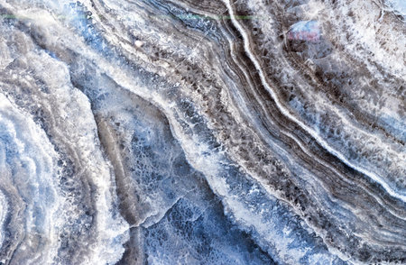 Black quartz stone with white and gray stripes. Natural quartz background and texture.の写真素材