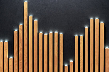 LED spotlights in decorative wooden lath on a black wall.の写真素材