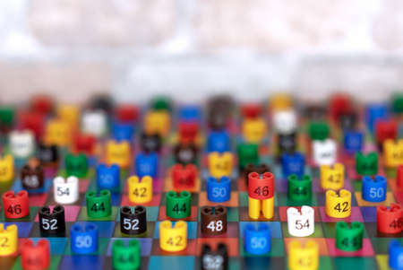 Plastic tags with clothing sizes on multi-colored squares.の写真素材