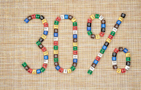 Thirty percent off discount sign made of plastic clothing size tags. The concept of discounts and promotions.の写真素材