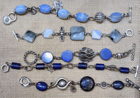 Silver bracelets with natural lapis lazuli, agate and moonstone.の写真素材