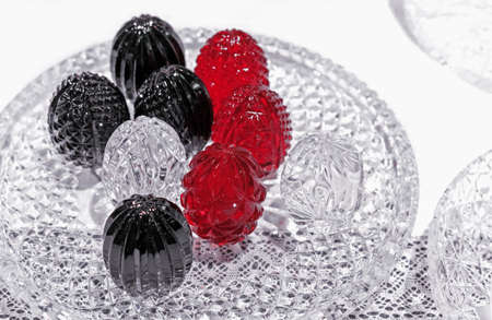 Multicolored crystal Easter eggs on the holiday table.の写真素材