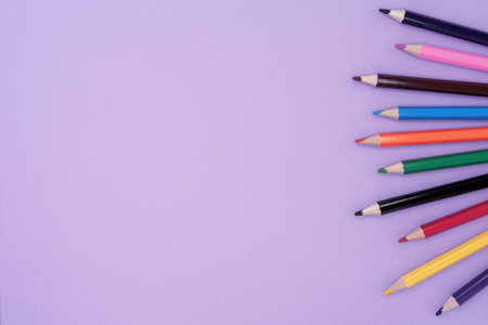 Colored pencils for drawing. Lilac background with pencils.の写真素材