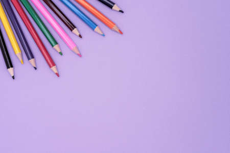 Colored pencils for drawing. Lilac background with pencils.の写真素材