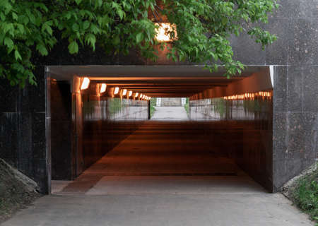 Illuminated pedestrian crossing. Underground pass. Tunnel.の写真素材