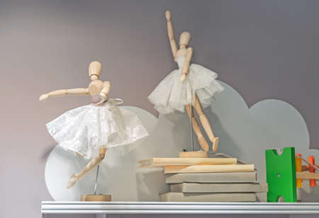 Wooden ballerina dolls in lace skirts. Gestalta toy in the shape of a ballerina.