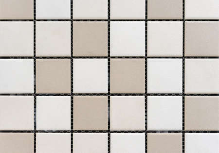 Ceramic mosaic tiles with beige and light beige squares.の写真素材