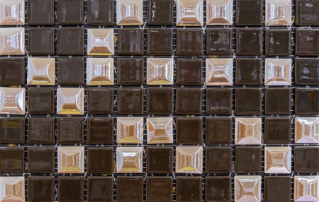 Ceramic mosaic tiles with brown and beige squares.の写真素材