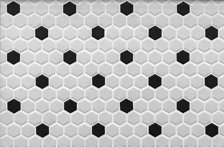 Gray-black ceramic mosaic tiles in the shape of honeycombs.の写真素材