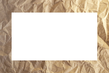 Frame of crumpled kraft paper with a white middle.の写真素材