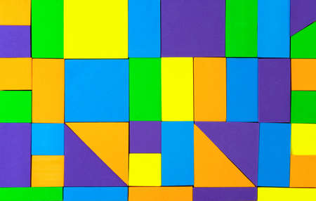 Background with multi-colored mathematical figures. Colored squares, rectangles and triangles.の写真素材