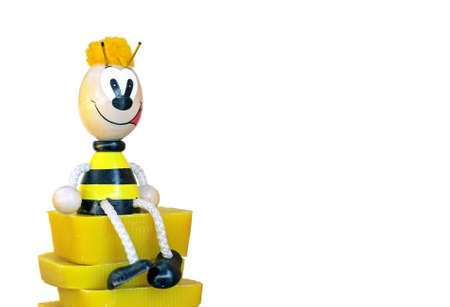 Wooden figurine of a bee isolated on white.の写真素材